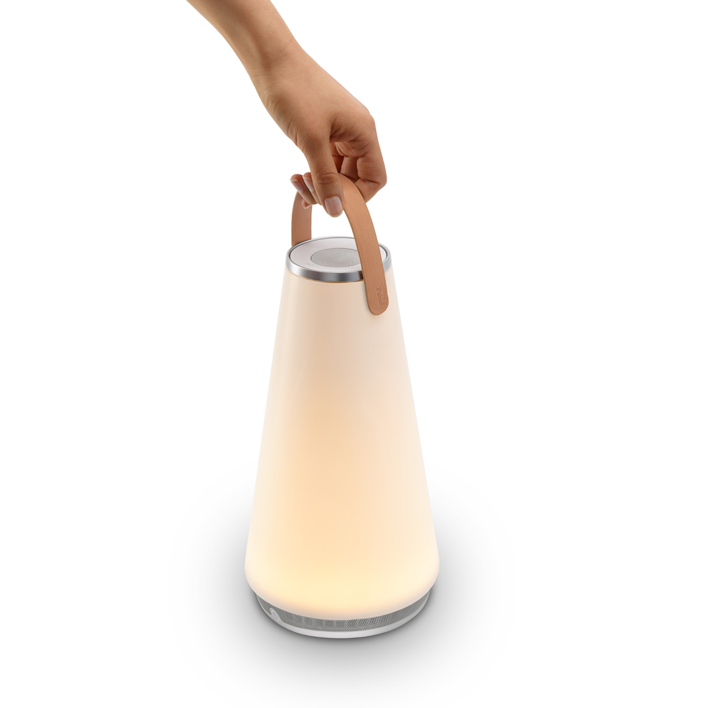 The Uma Sound Table Lamp from Pablo Designs handheld.