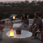 The Uma Sound Table Lamp from Pablo Designs in an outdoor living space.
