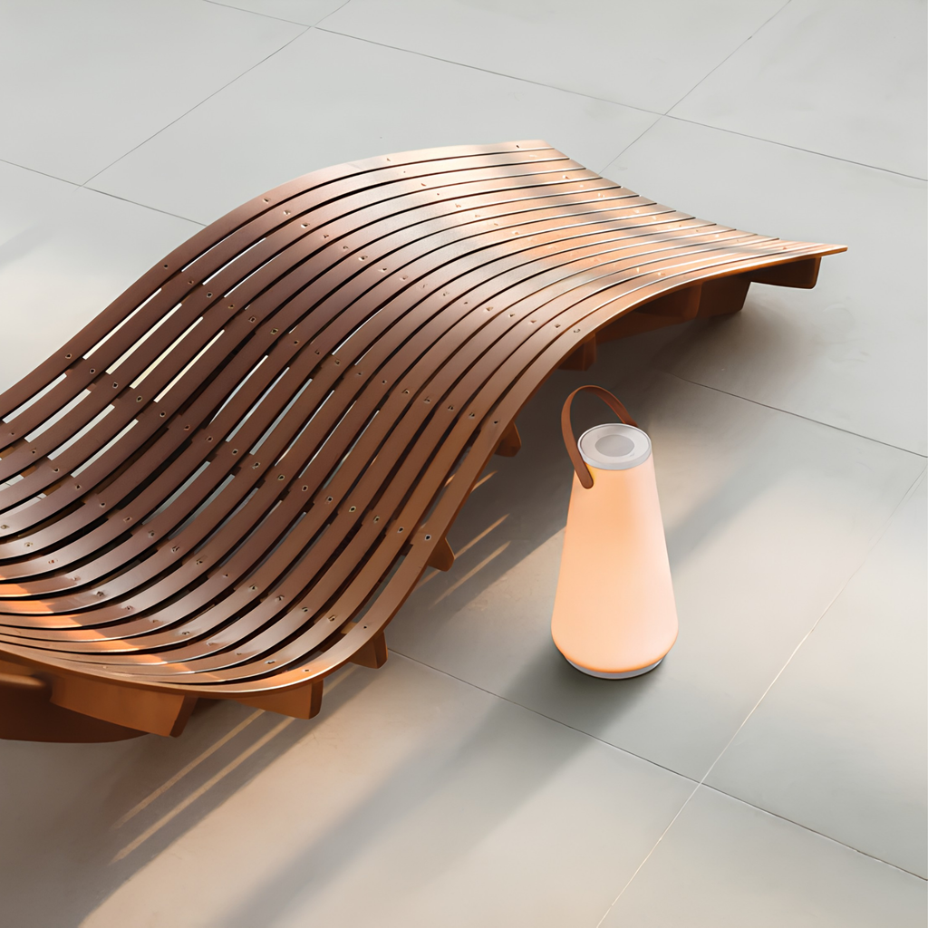 The Uma Sound Table Lamp from Pablo Designs in an outdoor lounge.
