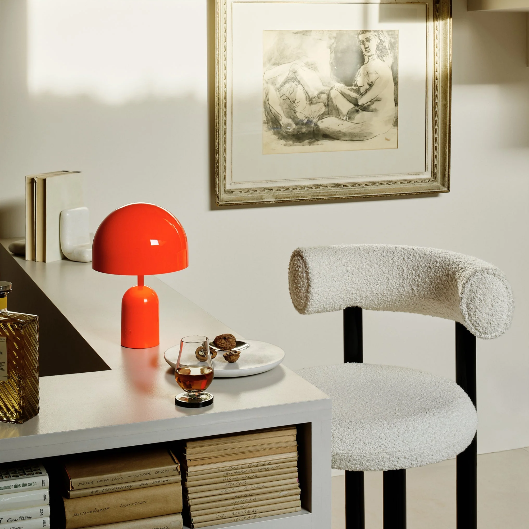 The fluoro Bell Cordless Lamp from Tom Dixon shown in a kitchen and dining space.