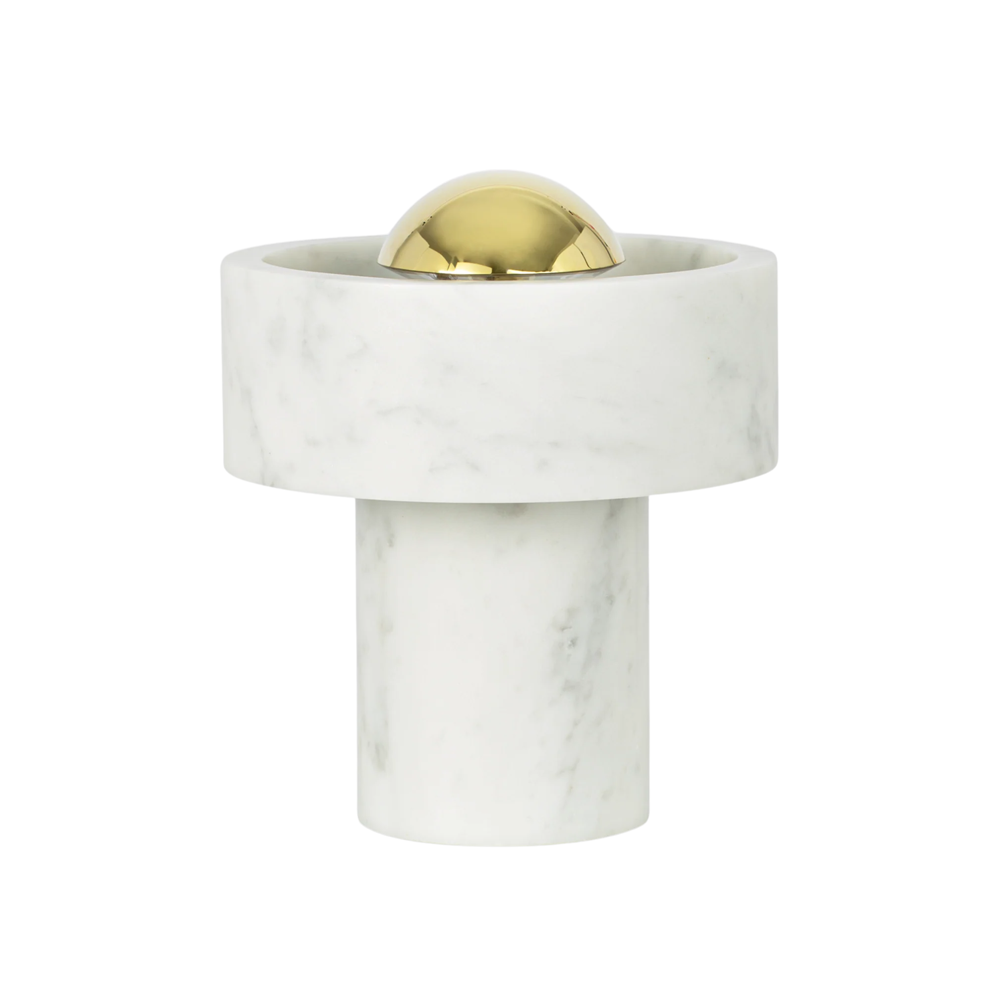The gold Stone Cordless Lamp from Tom Dixon turned off in a studio.