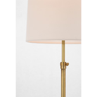 The brass Bryant Adjustable Cordless Floor Lamp showing the shade and post with the adjustable height knob visible.