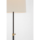 The bronze and hand rubbed antique brass Bryant Adjustable Cordless Floor Lamp, a modern lighting fixture.