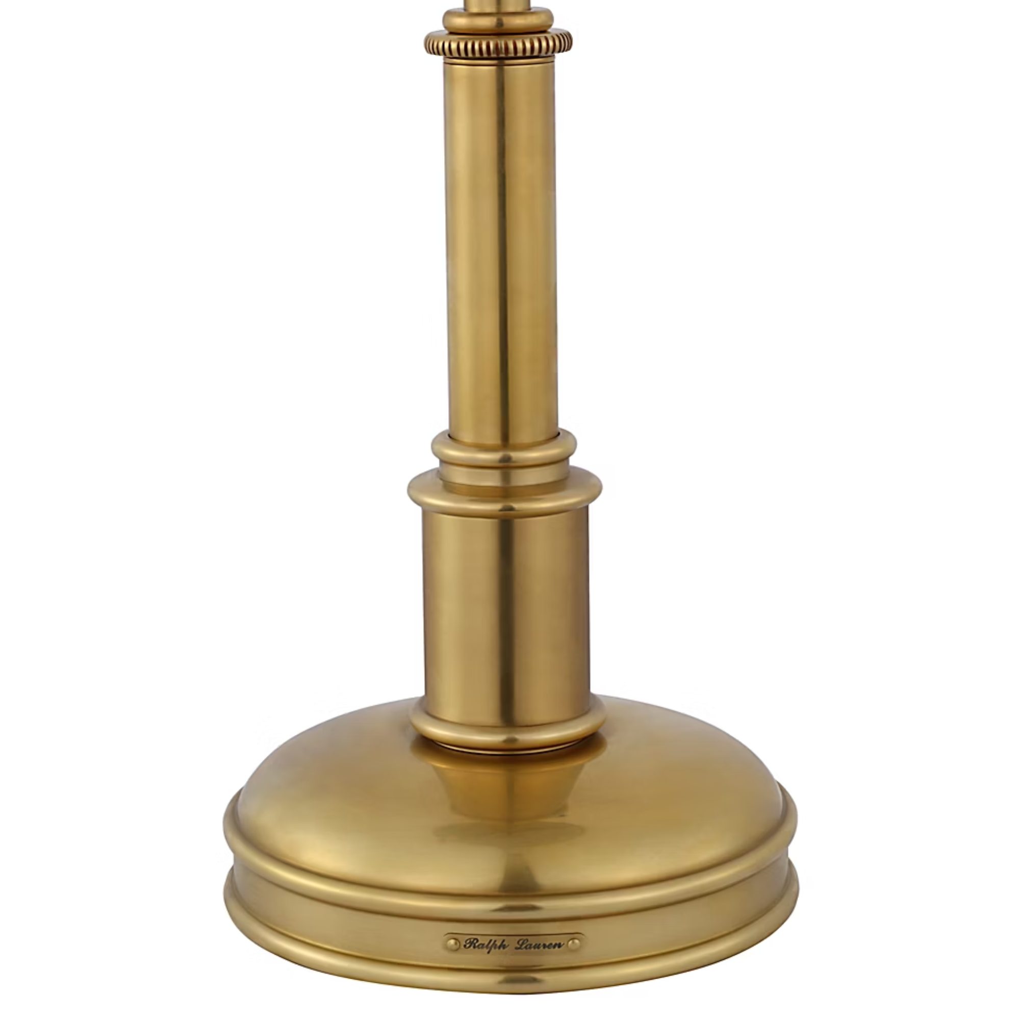 The brass Carthage Cordless Lamp from Visual Comfort Signature base with Ralph Lauren signature plate.