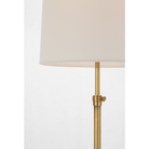 The brass Bryant Adjustable Cordless Floor Lamp shade and post.