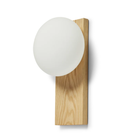 The white pigmented oak Dew Cordless Table Lamp & Wall Sconce from Woud close up.