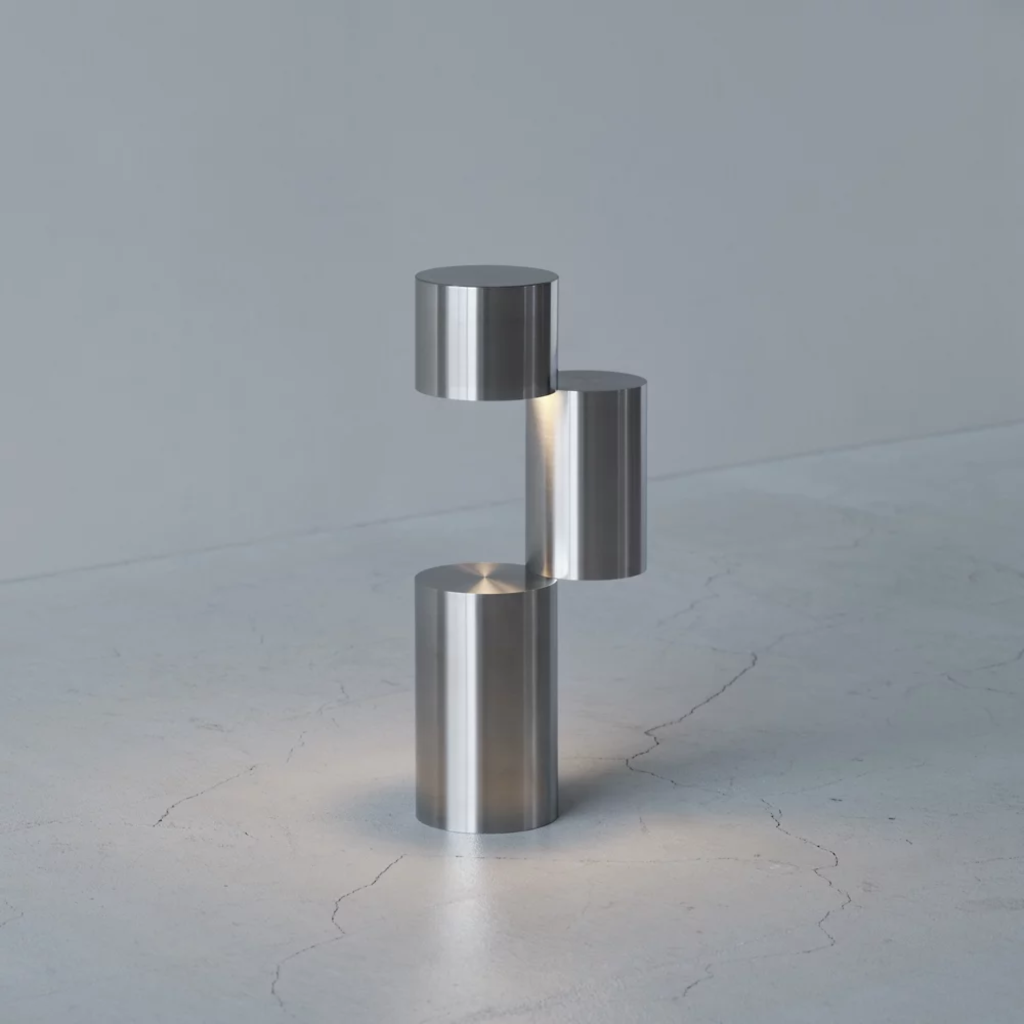 The MOMENT Cordless Lamp from Y.S.M, configuration three (3) in a living space on a stone surface.