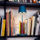 The avio blue Poldina Pro from Zafferano in a home office on a bookshelf.