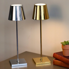 The glossy gold Poldina Pro from Zafferano in a lounge with the chrome Poldina Pro.