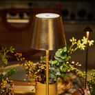 The gold leaf Poldina Pro from Zafferano in a restaurant on a dining table.