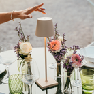 The sand Poldina Pro from Zafferano used in an outdoor dining space on top of a table.