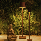 The rust Poldina Pro XXL Floor Lamp from Zafferano in a home office.