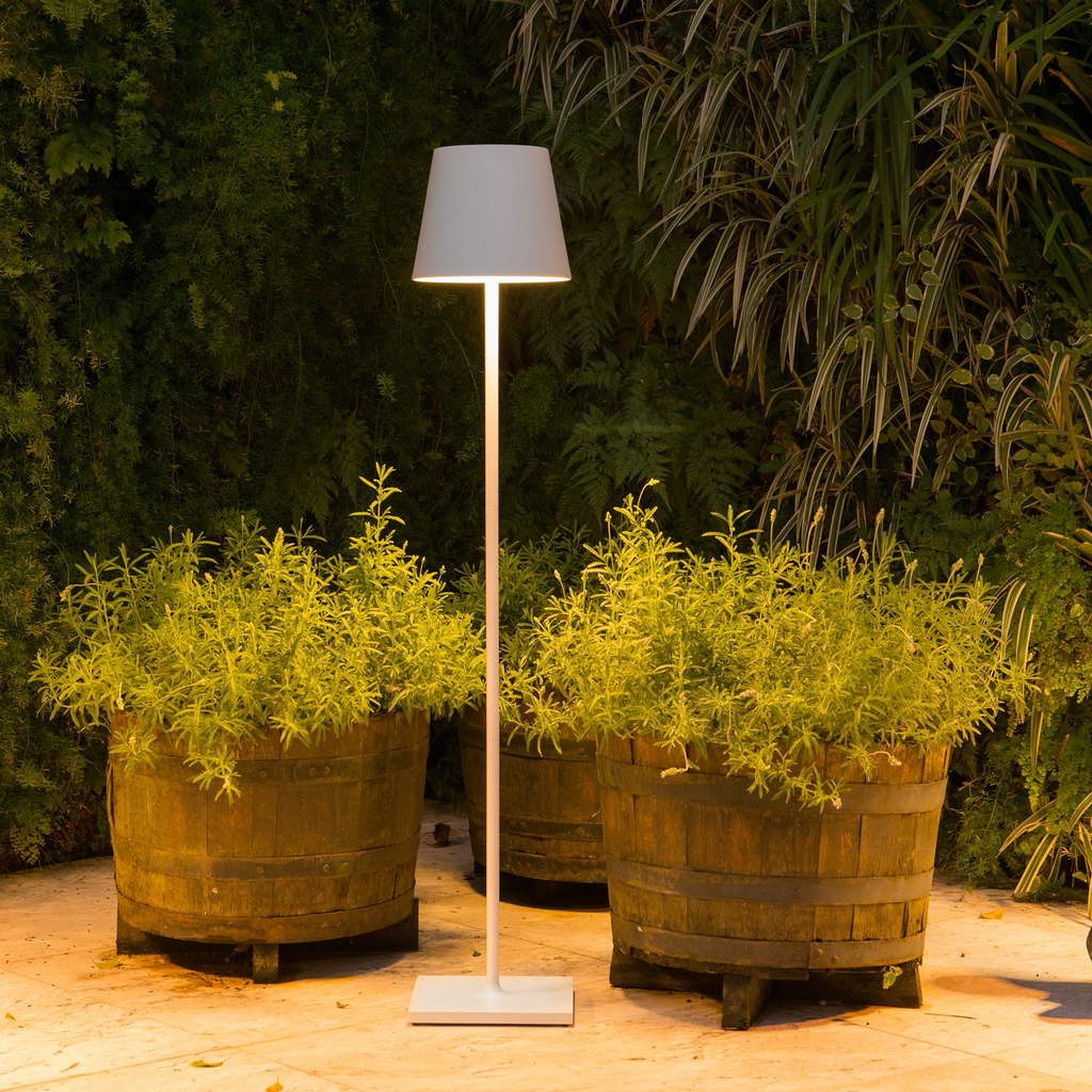 The white Poldina Pro XXL Floor Lamp from Zafferano in a living space.